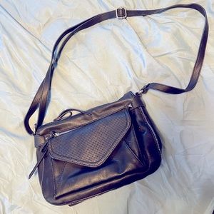 Black Jessica Simpson purse with zipper details and leopard lining
